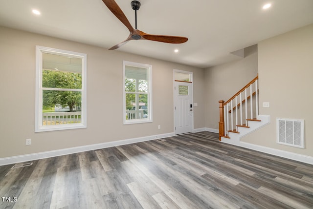 entryway with ceiling fan and dark hardwood / wood-style flooring