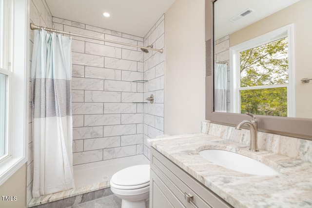 bathroom with vanity, toilet, and a shower with shower curtain