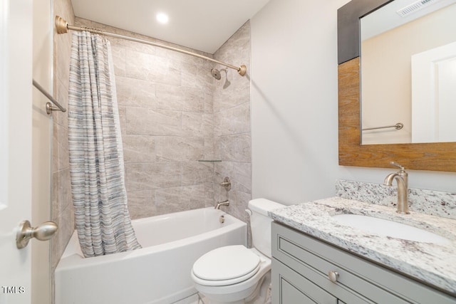 full bathroom with shower / bathtub combination with curtain, vanity, and toilet