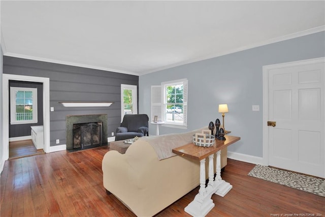 living room with ornamental molding and hardwood / wood-style floors