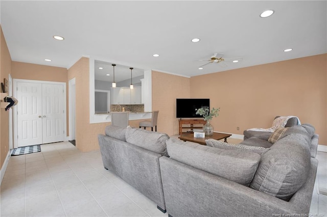 living room featuring ceiling fan and light tile patterned floors