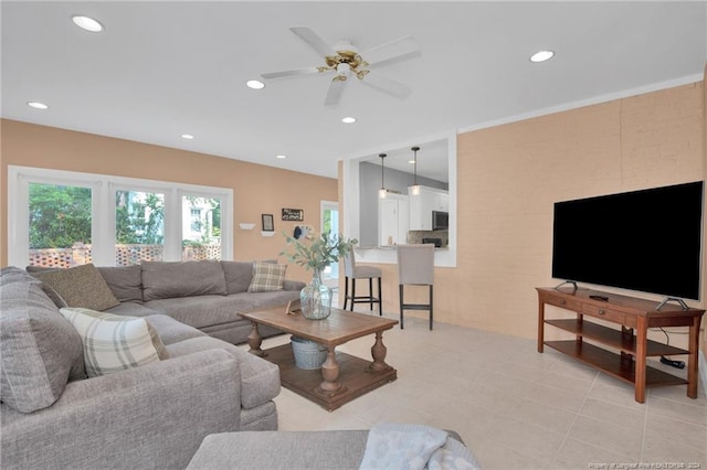 living room with ceiling fan and light tile patterned floors