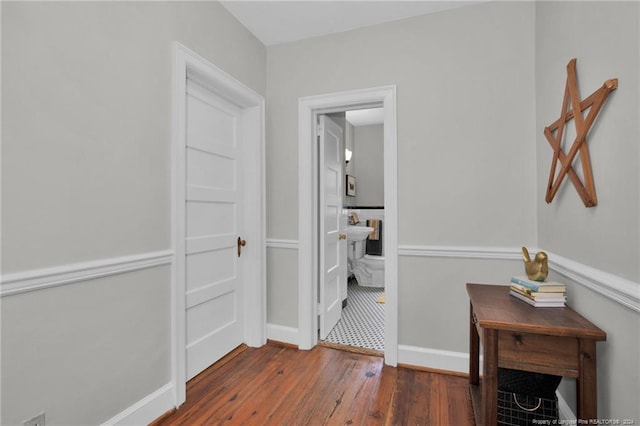 hall with dark hardwood / wood-style floors