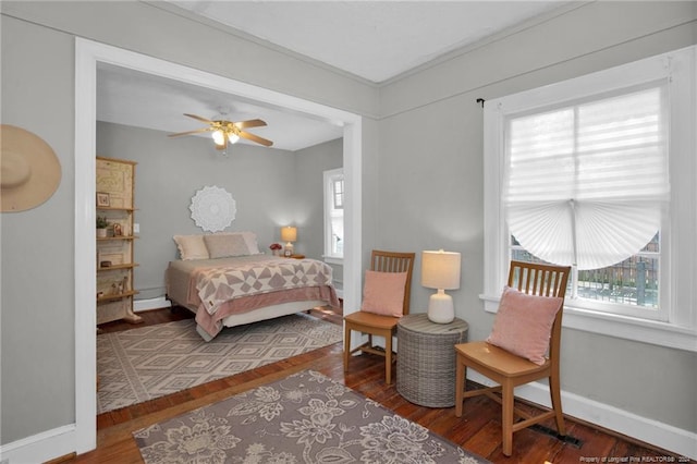 bedroom featuring wood-type flooring and ceiling fan