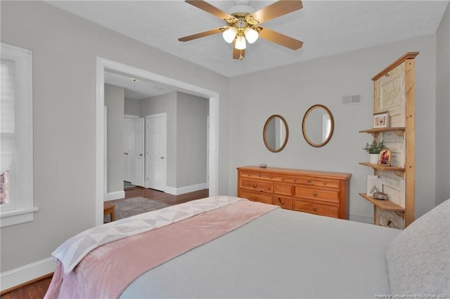 bedroom featuring dark wood-type flooring and ceiling fan