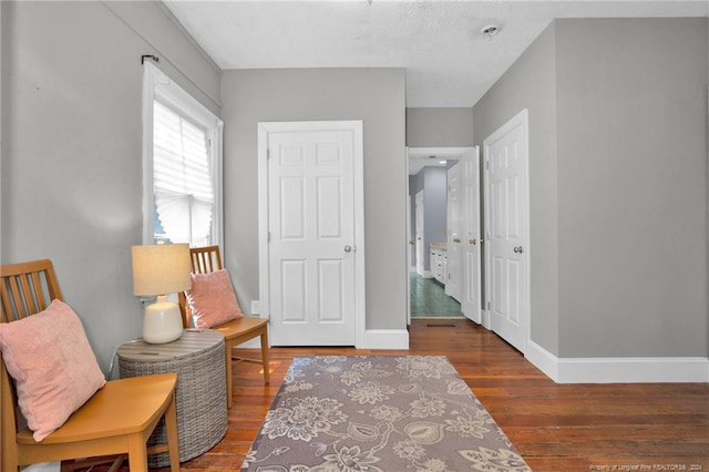 living area with wood-type flooring