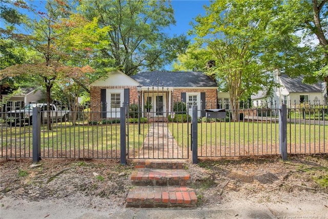 507 Huske St, Fayetteville, NC 28305 - view of front facade with a fenced front yard, brick siding, a front lawn, and a gate