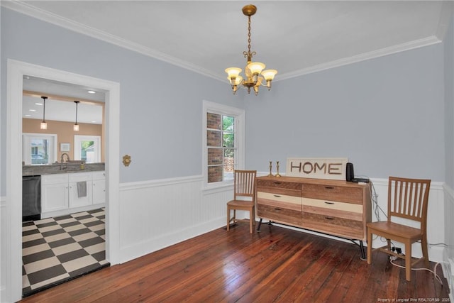 507 Huske St, Fayetteville, NC 28305 - living area with an inviting chandelier, crown molding, a wainscoted wall, and wood-type flooring