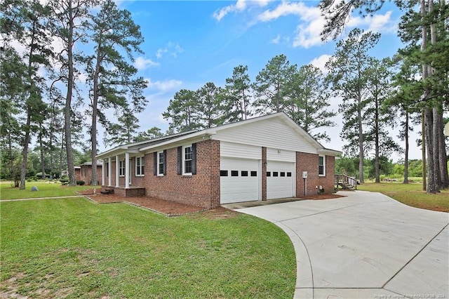 view of home's exterior with a garage and a lawn