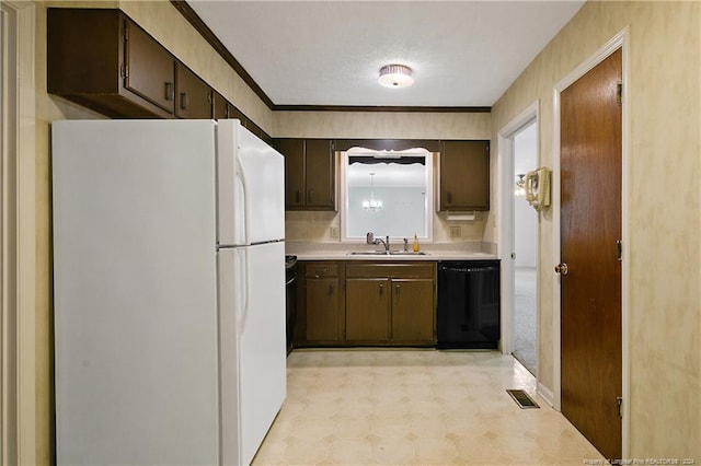 kitchen with dark brown cabinets, black dishwasher, a textured ceiling, sink, and white fridge