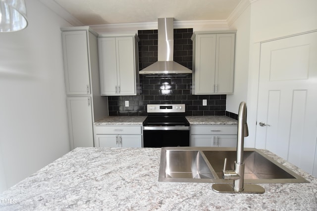 kitchen with backsplash, crown molding, sink, wall chimney range hood, and stainless steel electric range