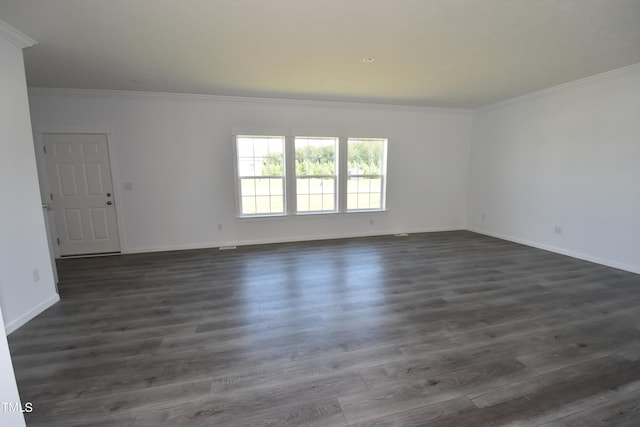 unfurnished room with dark hardwood / wood-style flooring and ornamental molding