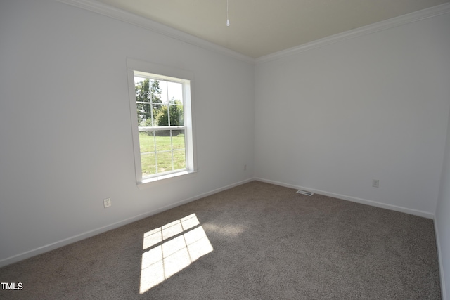 spare room with dark carpet and ornamental molding