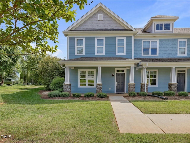 craftsman-style house featuring a front yard