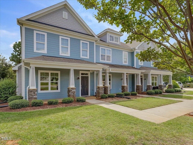 craftsman house featuring a front yard