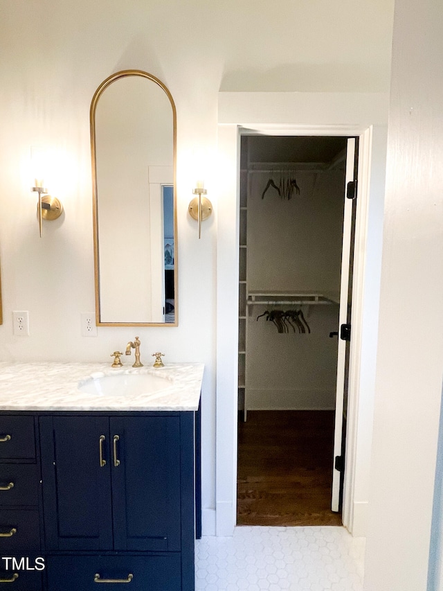 bathroom with vanity and hardwood / wood-style floors