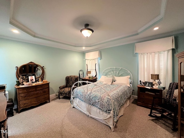 carpeted bedroom featuring a raised ceiling and crown molding