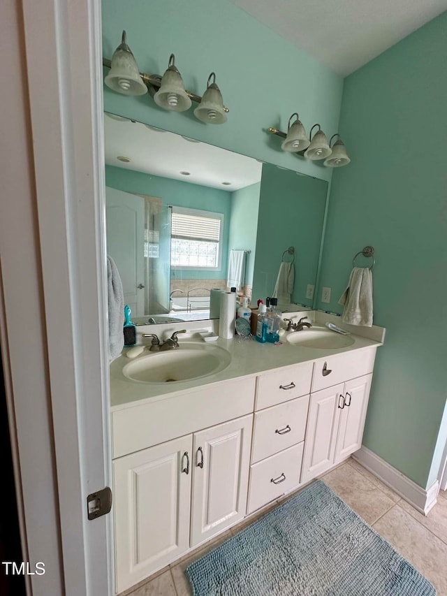 bathroom featuring tile patterned flooring and vanity