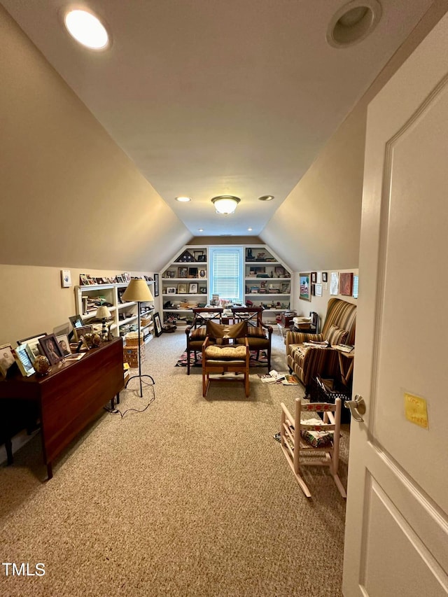 interior space featuring built in shelves and vaulted ceiling