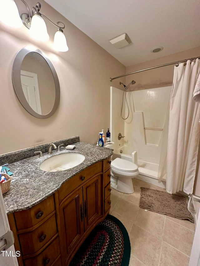 full bathroom with vanity, toilet, shower / bath combo with shower curtain, and tile patterned floors