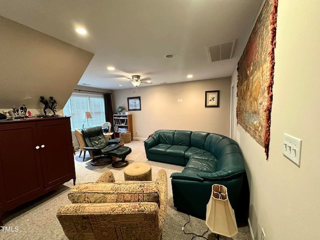 carpeted living room featuring ceiling fan