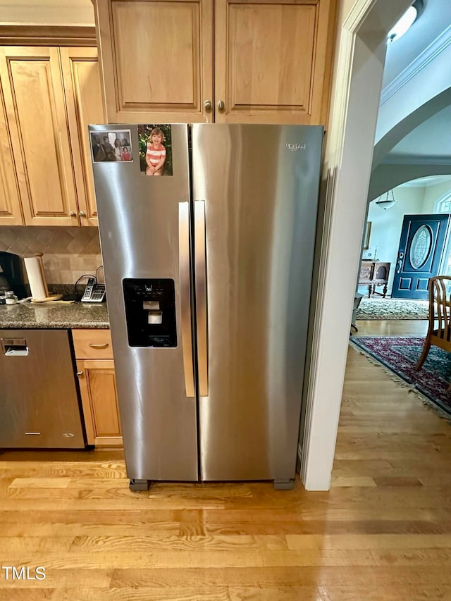 kitchen featuring light hardwood / wood-style flooring, backsplash, stainless steel fridge with ice dispenser, and crown molding