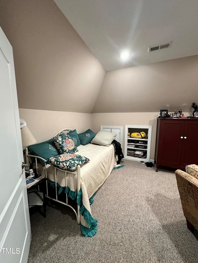 bedroom featuring light carpet and lofted ceiling