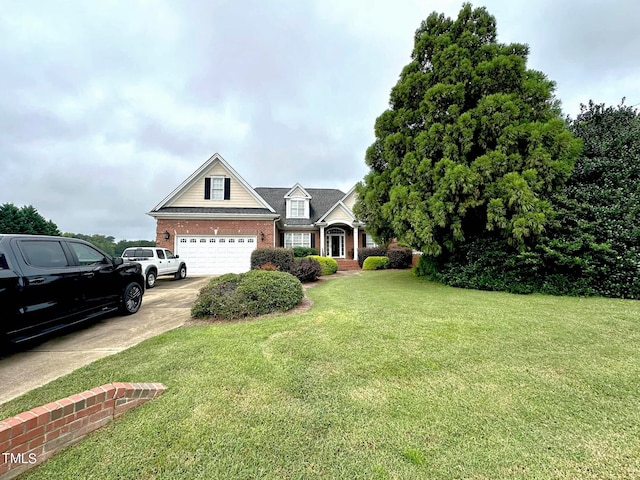 view of front facade with a garage and a front lawn