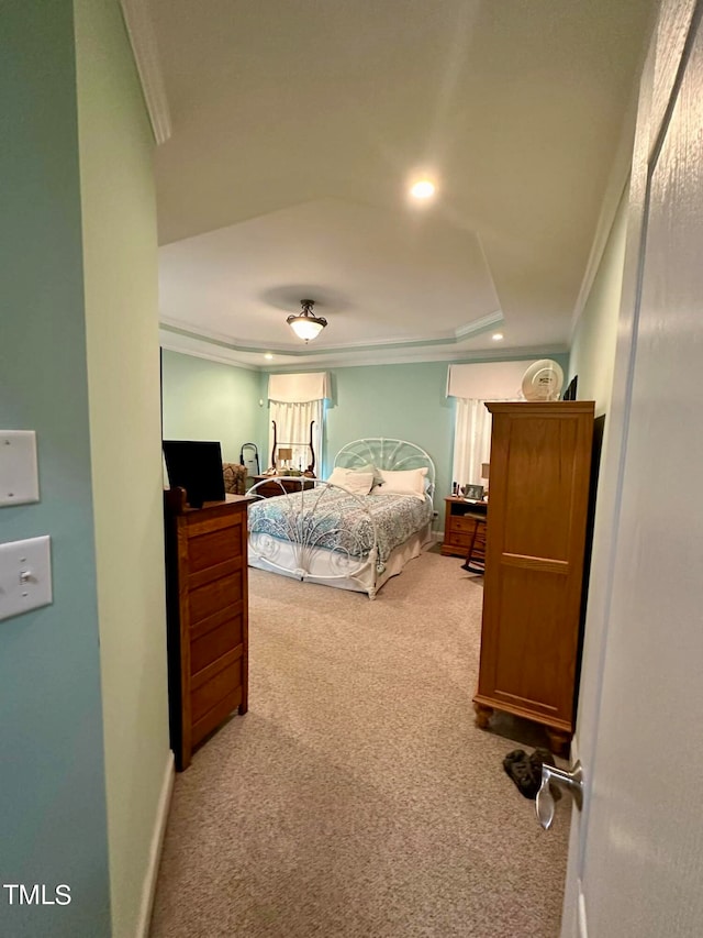 carpeted bedroom with crown molding and ceiling fan