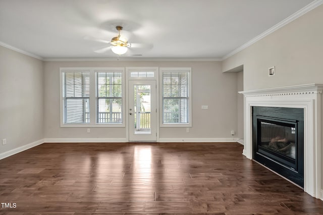 unfurnished living room featuring ceiling fan, ornamental molding, and dark hardwood / wood-style flooring