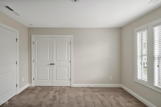 1215 Alston Forest Dr, Cary, NC 27519 - unfurnished bedroom with light colored carpet and a closet