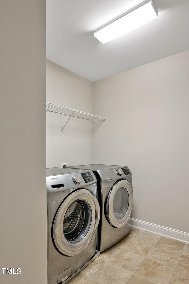 clothes washing area with washer and dryer