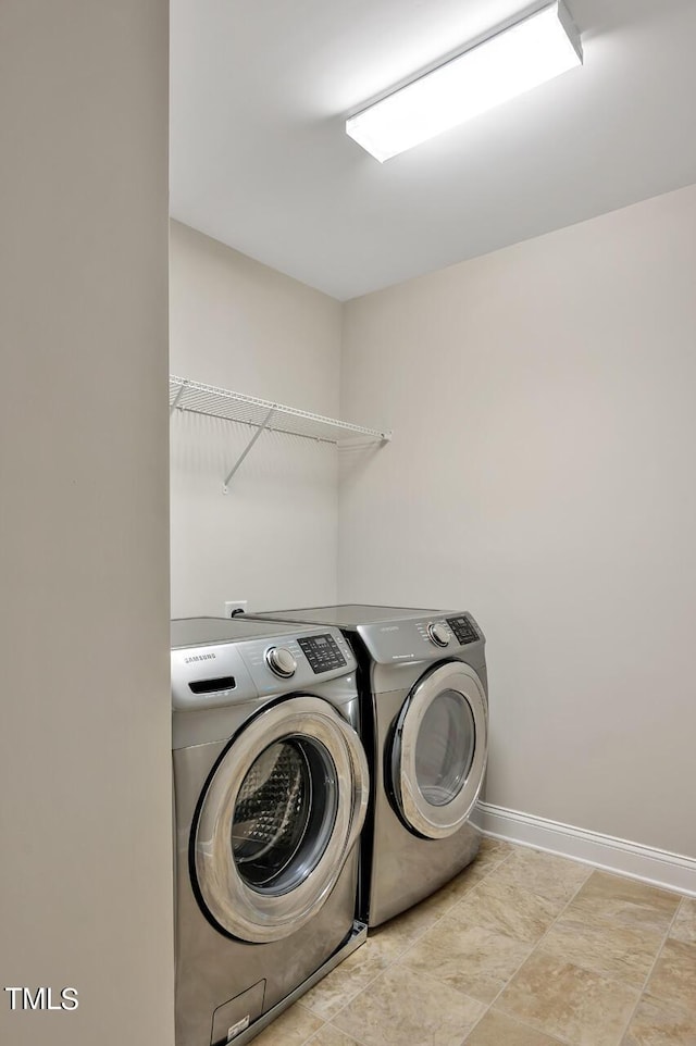 1215 Alston Forest Dr, Cary, NC 27519 - laundry room featuring washing machine and dryer and baseboards