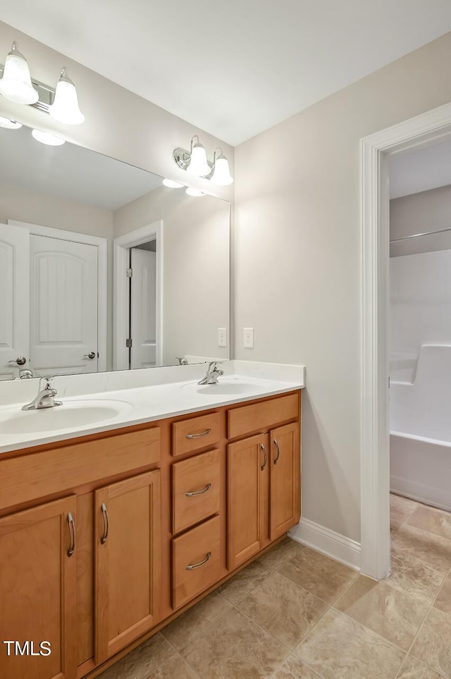 1215 Alston Forest Dr, Cary, NC 27519 - bathroom featuring double vanity and baseboards