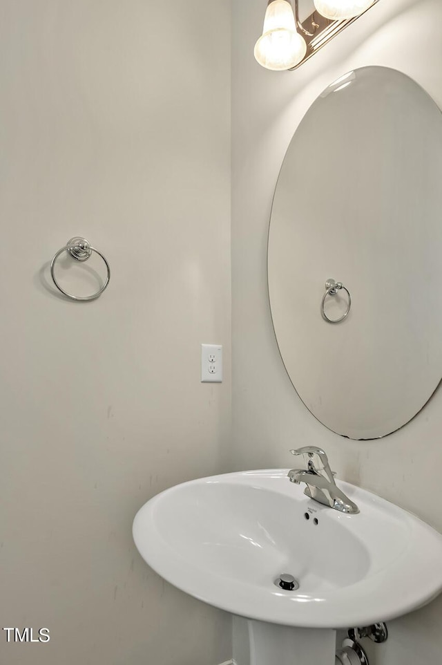 1215 Alston Forest Dr, Cary, NC 27519 - bathroom featuring a sink and a chandelier