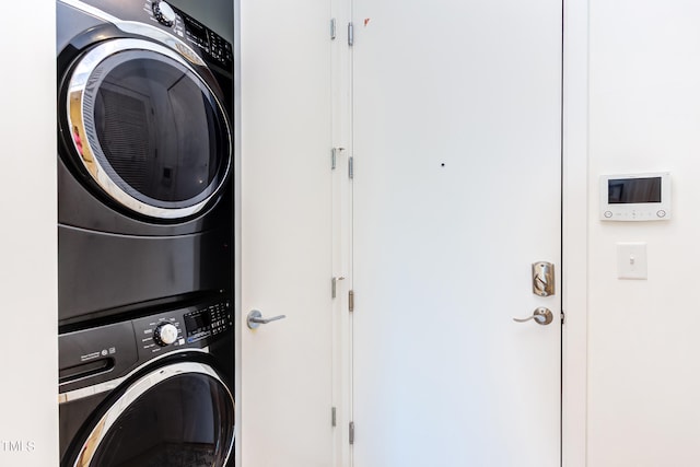 laundry room featuring stacked washer and clothes dryer