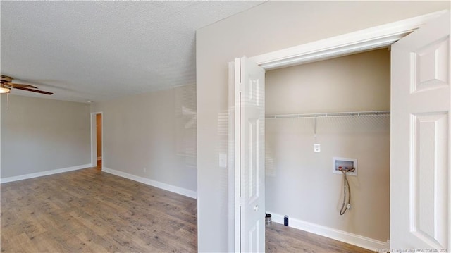 laundry area with hardwood / wood-style floors, hookup for a washing machine, a textured ceiling, and ceiling fan