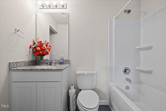 full bathroom with vanity, toilet, and washtub / shower combination