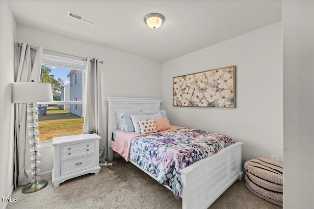 bedroom with light carpet