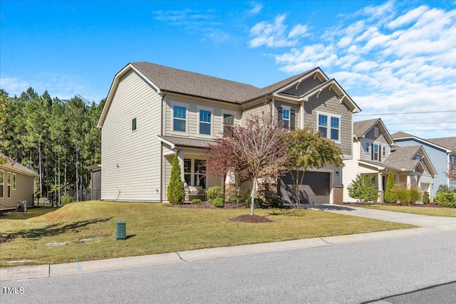 view of front of property featuring a front yard and a garage