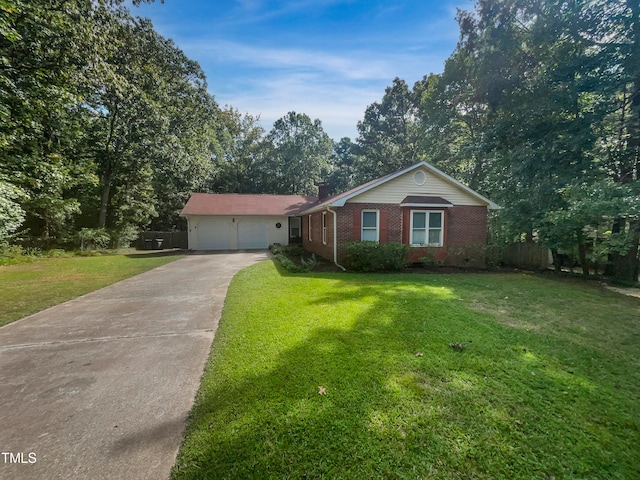 ranch-style house featuring a garage and a front lawn