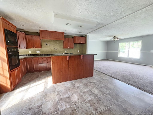 kitchen featuring a textured ceiling, black appliances, a kitchen breakfast bar, light colored carpet, and decorative backsplash