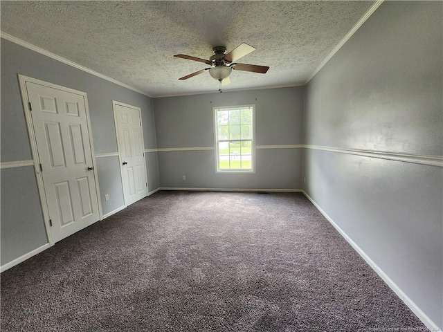 spare room featuring crown molding, ceiling fan, carpet, and a textured ceiling