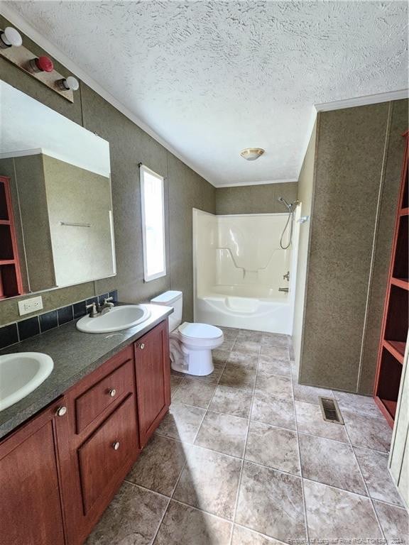 full bathroom featuring vanity, shower / bath combination, a textured ceiling, tile patterned floors, and toilet