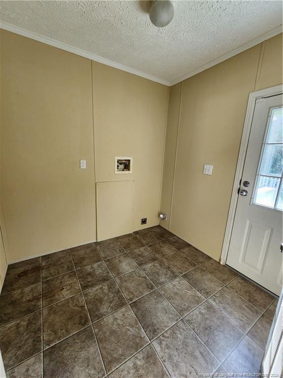 laundry area featuring ornamental molding, hookup for a washing machine, and a textured ceiling