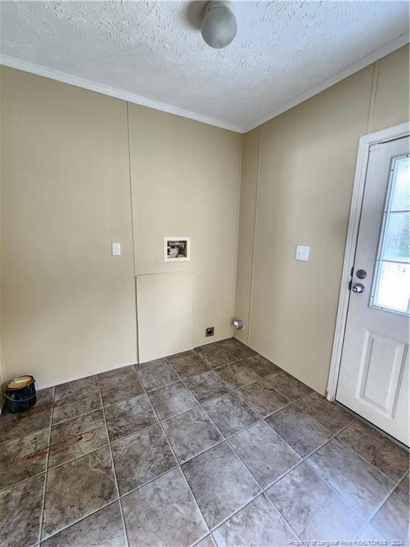 clothes washing area with hookup for a washing machine, a textured ceiling, and ornamental molding