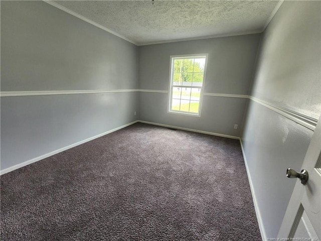 carpeted empty room featuring crown molding and a textured ceiling