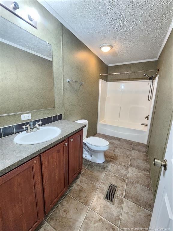 full bathroom with toilet, crown molding, shower / washtub combination, vanity, and a textured ceiling