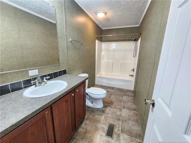 full bathroom with washtub / shower combination, vanity, tile patterned floors, toilet, and a textured ceiling