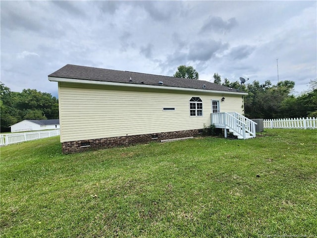 back of house featuring a yard